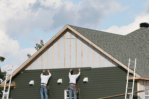 Professional Storm Damage Siding Repair technician working in Lawrenceburg, IN
